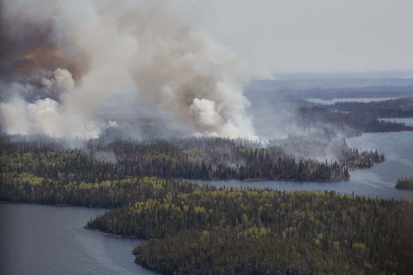 Mandatory Credit: Photo by Canadian Press/Shutterstock (14481302b) A wildfire burns in northern Manitoba near near Flin Flon, as seen from a helicopter surveying the situation, Tuesday, May 14, 2024. Mba-Wildfire, Flin Flon, Canada - 14 May 2024