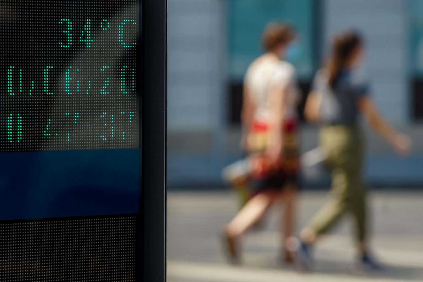 2C5M1RA Bucharest, Romania - June 30, 2019: 35 degrees celsius (92 fahrenheit) is the temperature displayed by a digital thermometer on a hot summer on a stre